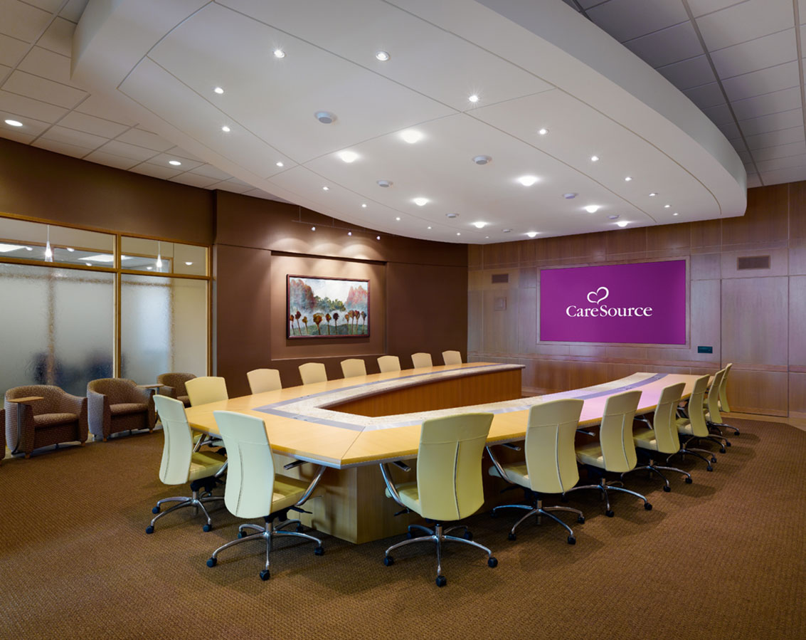 A conference room with a u-shaped table