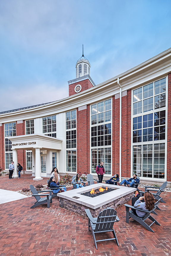 Outdoor seating, like this gathering area with a fire pit at Lycoming College Krapf Gateway Center, may need to increase to accommodate social distancing.