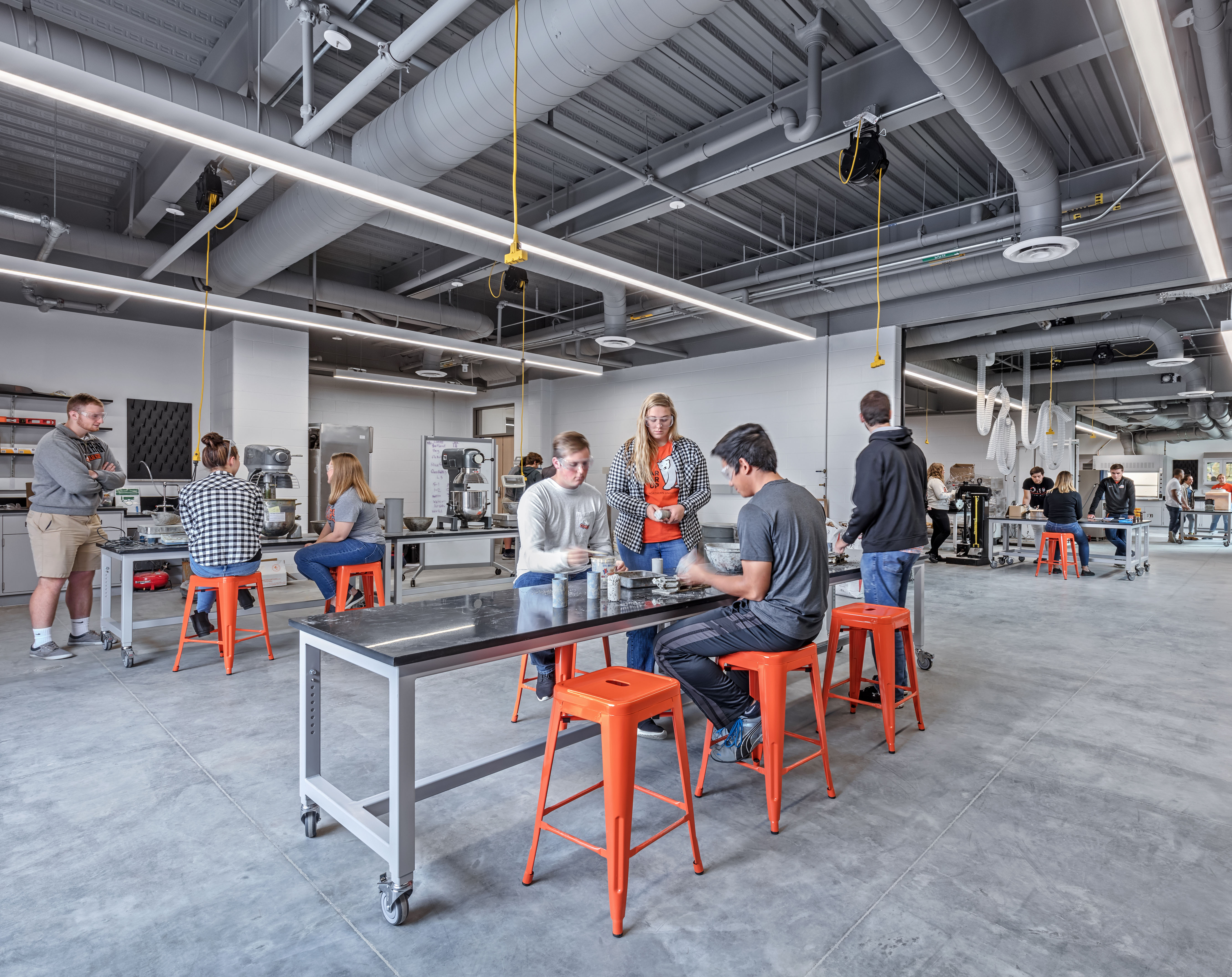 Students complete hands-on work together in a shop environment