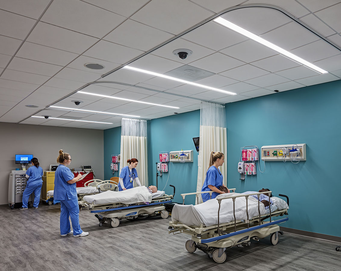 Hospital beds being used by students as a learning exercise