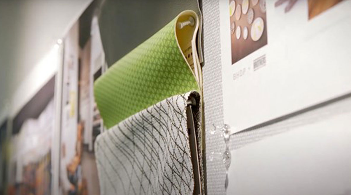 Fabric samples tacked to the wall