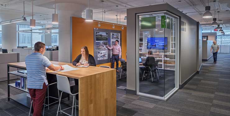 employees at standing table