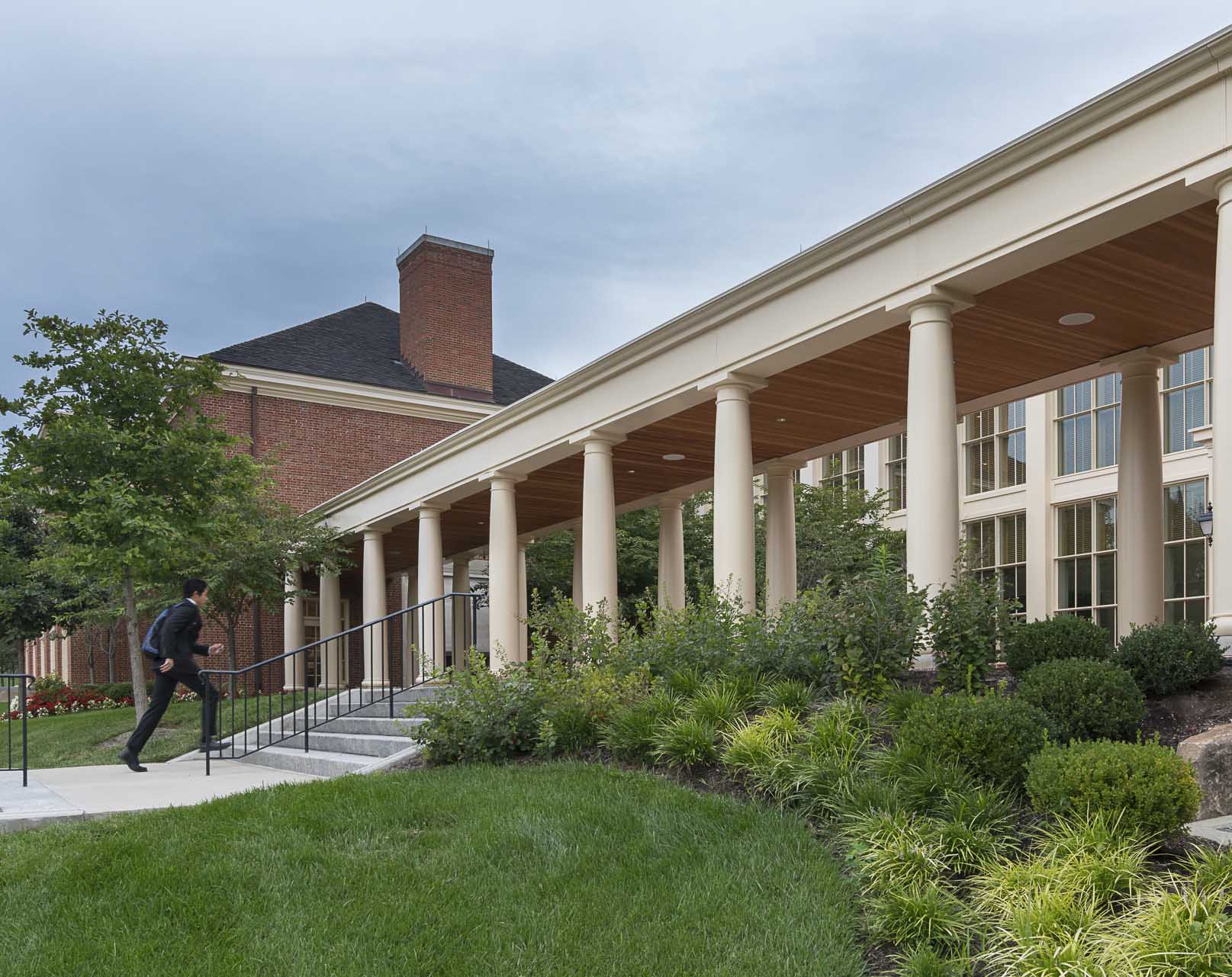 Student walking up steps to Armstrong Student Center East Wing entrance