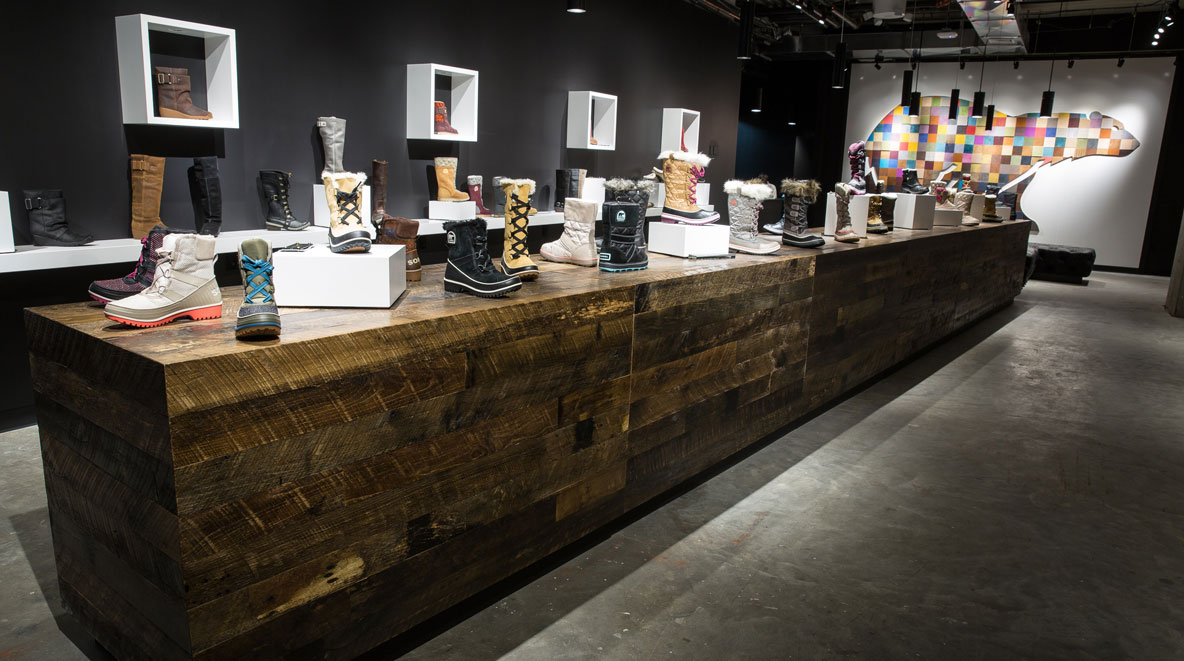 long wooden display table at Sorel in NYC