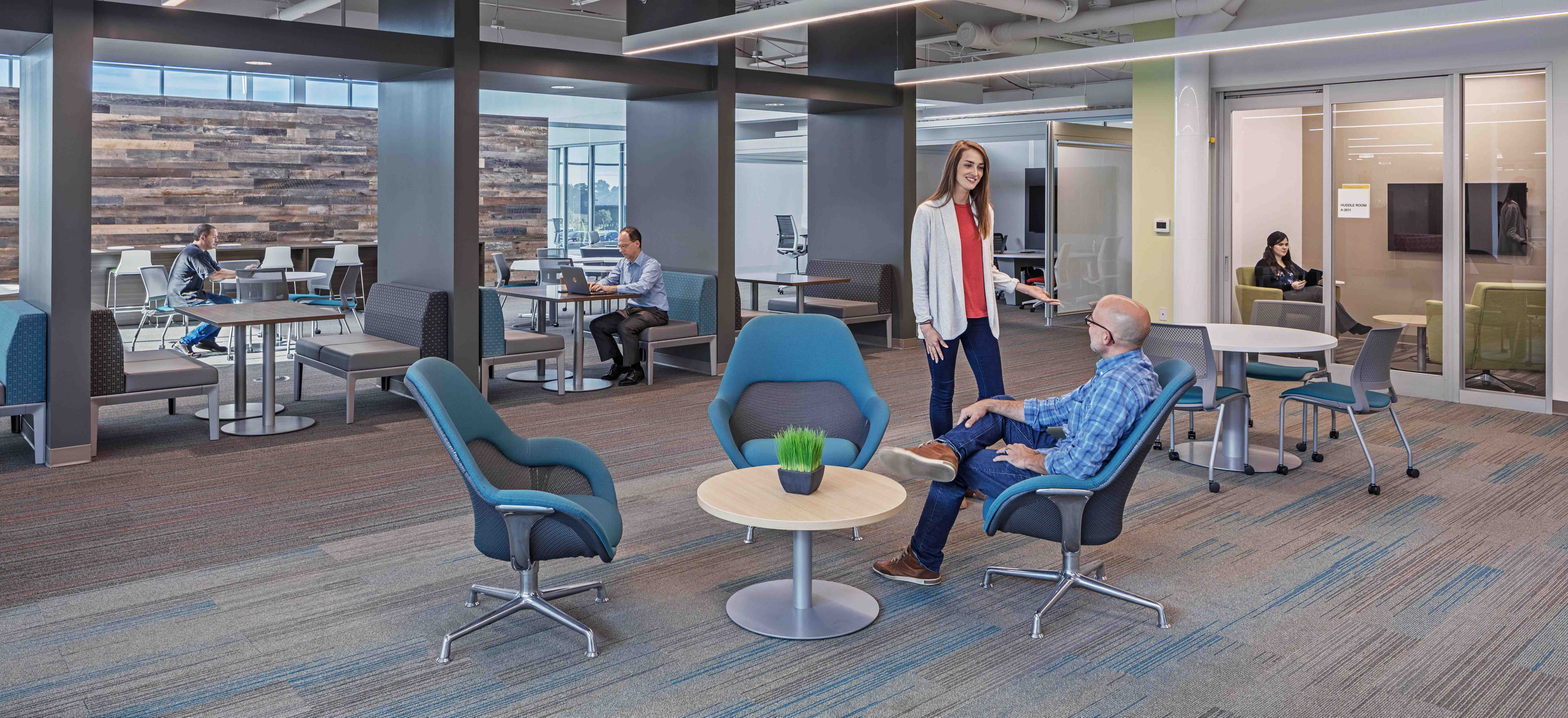 People converse in the Toyota Georgetown Production Facility office space