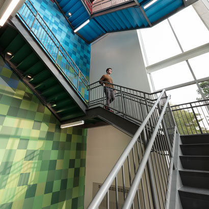 Man walking down stairs at Altria HQ