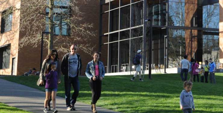 family walking on college campus