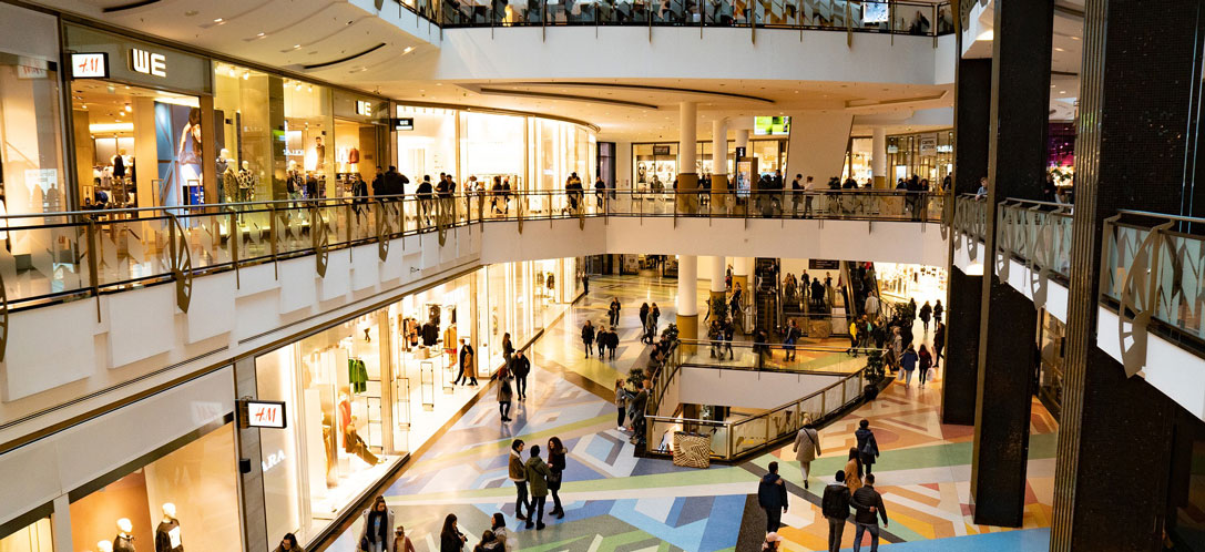 View of shopping center crowded with people