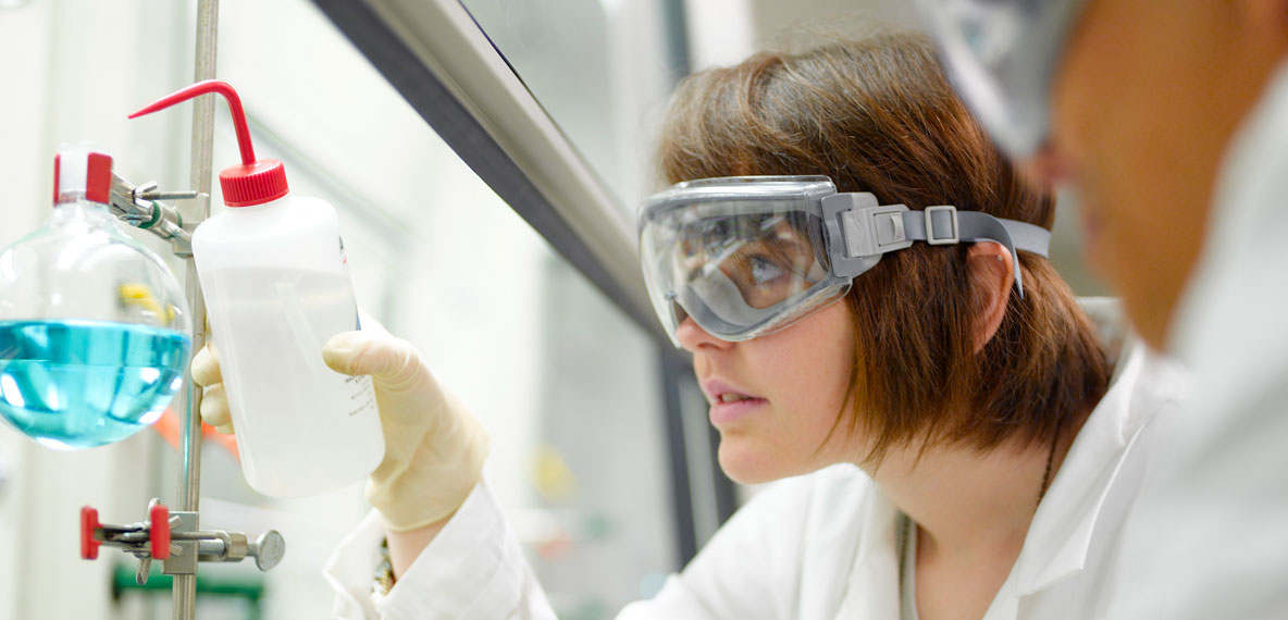 Scientists work with hazardous materials in laboratory
