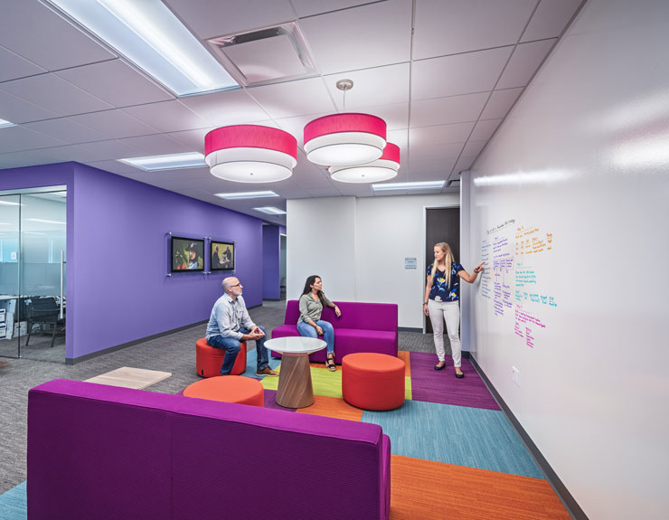Interior view of colorful collaboration area within Aetna's renovated office