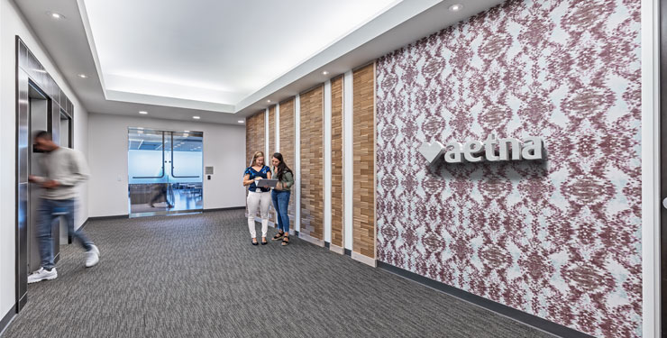 Interior view of branded accent wall within Aetna's newly renovated St. Louis office