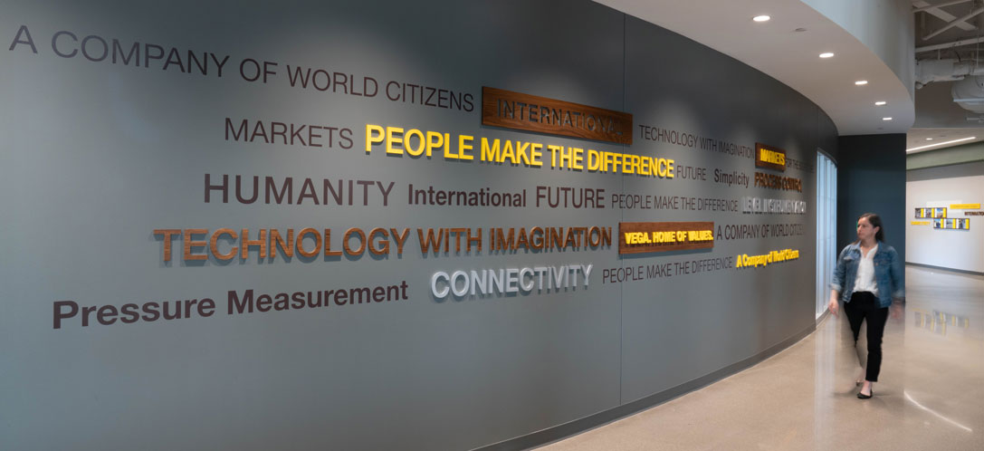 Experiential graphics of company values at VEGA Americas.