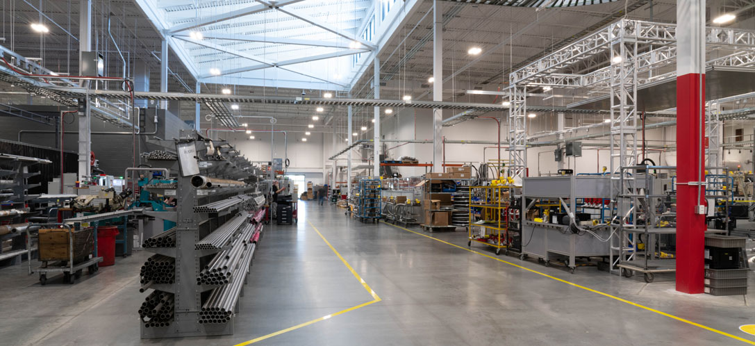 Natural light entering into the floor space of a manufacturing building.