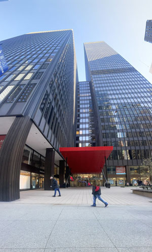 Image of the red canopy entrance to the two tours at Michigan Plaza in Chicago, IL.
