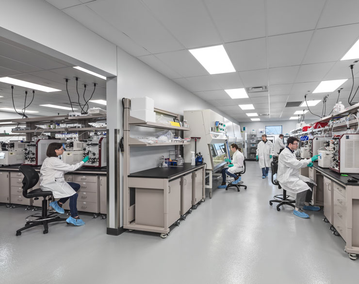 five people working in a lab at forge biologics