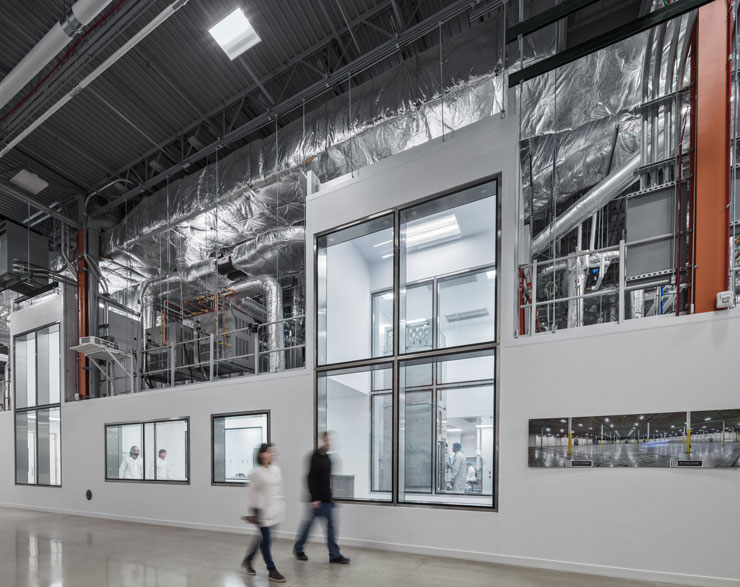 two people walking through the lab at Forge Biologics