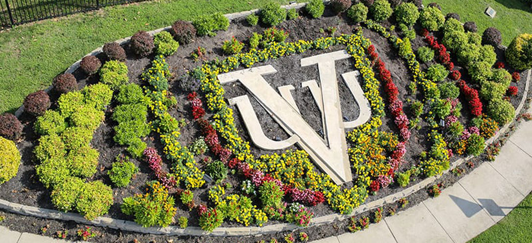 Floral landscaping highlighting Virginia Union University's logo on campus