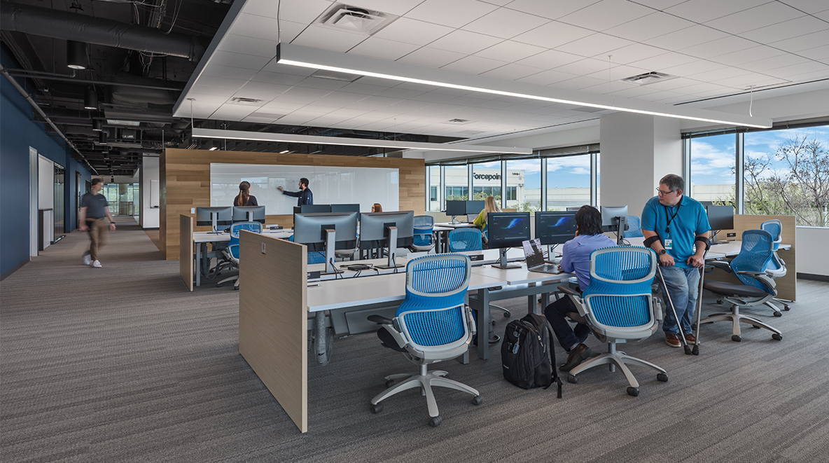 Collaborative computer spaces offer Forcepoint employees the ability to focus on their work and communicate with coworkers.