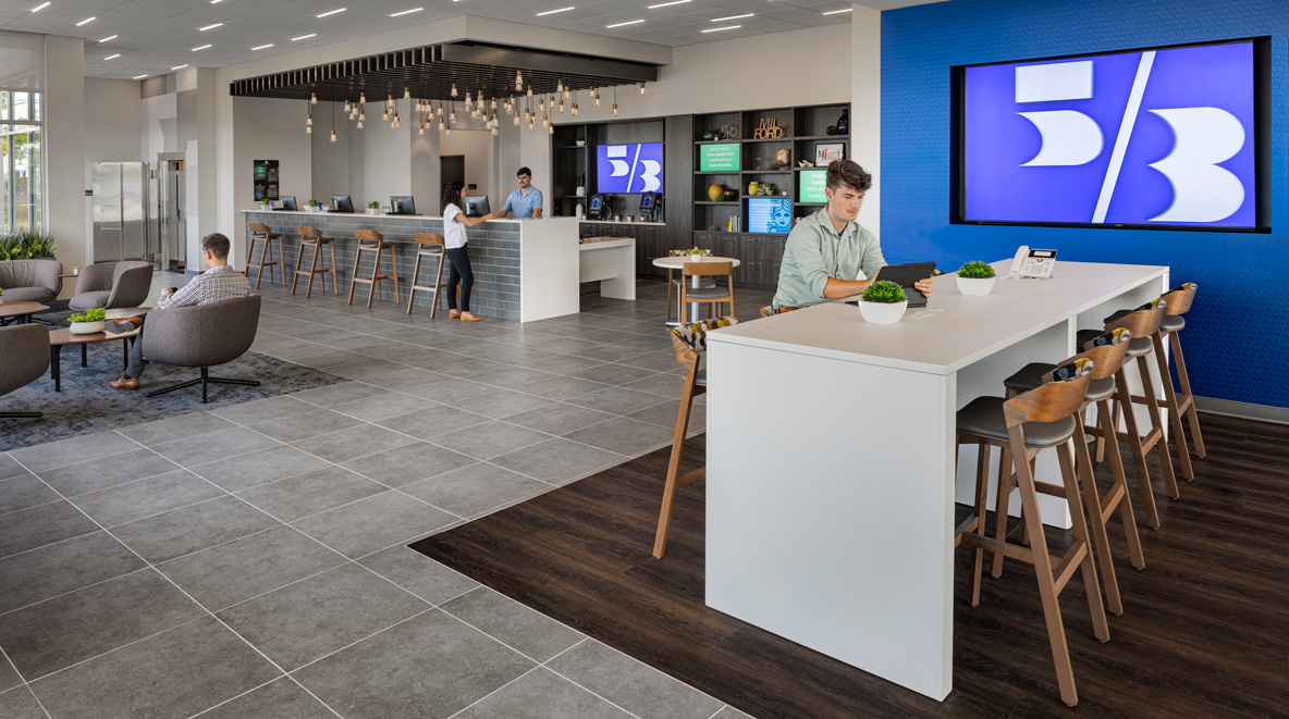 Customers utilizing various seating options and a transaction bar at Fifth Third Bank in Milford, OH