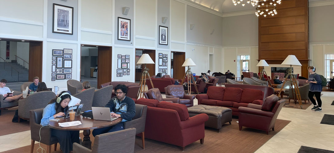 Students using the Shade Family Room as a social and study hub