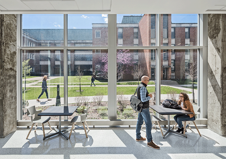 Visitors enjoying a seating area with a view of the outdoors and ample natural light.