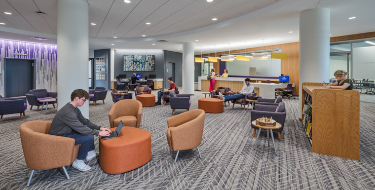 Students sit inside a new study area at Archer Library