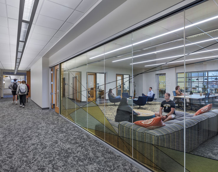 Photo looking through multiple lounge/common areas in the health science building
