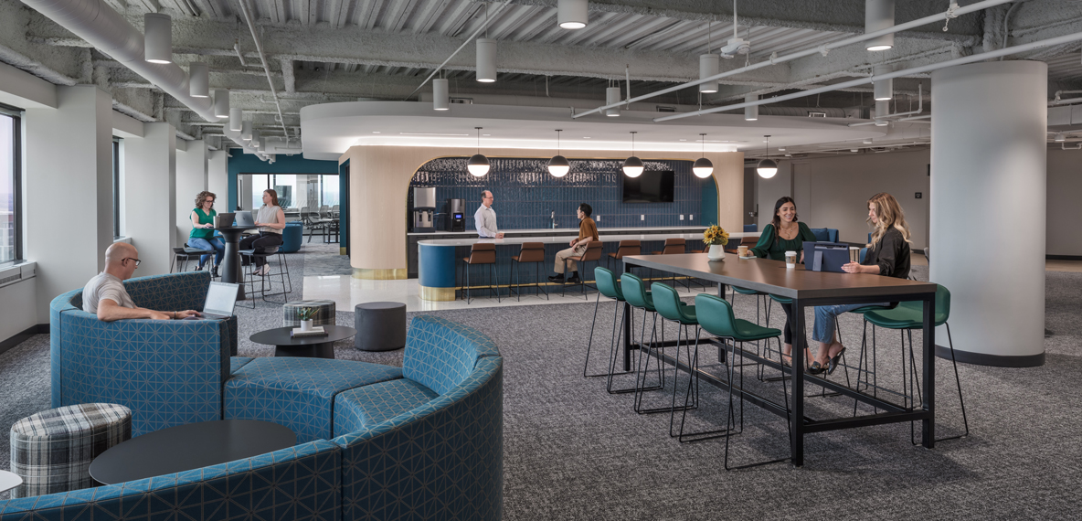 Employees gather in different areas of an employee amenities floor