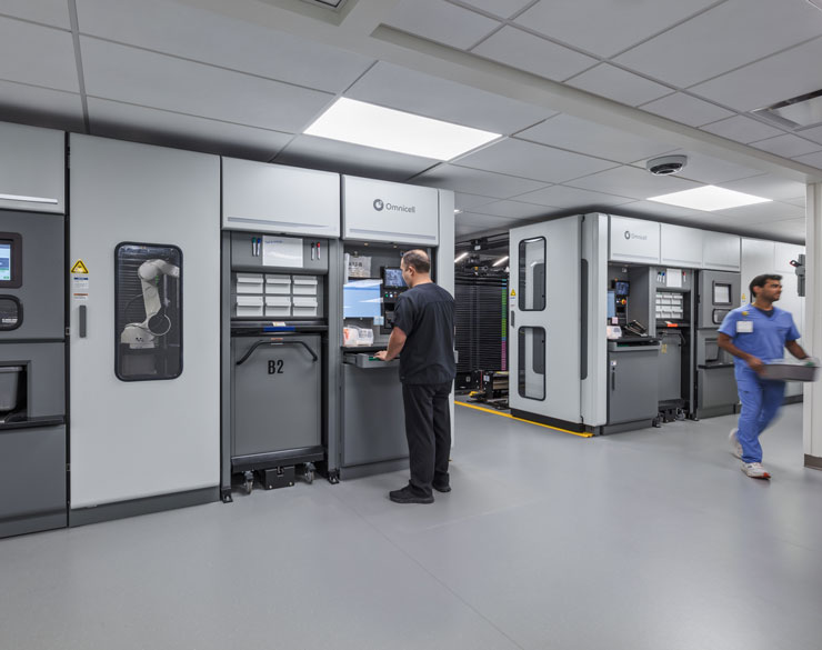 another perspective inside of UC Health's inpatient pharmacy, showing the robots that assist in medication packaging