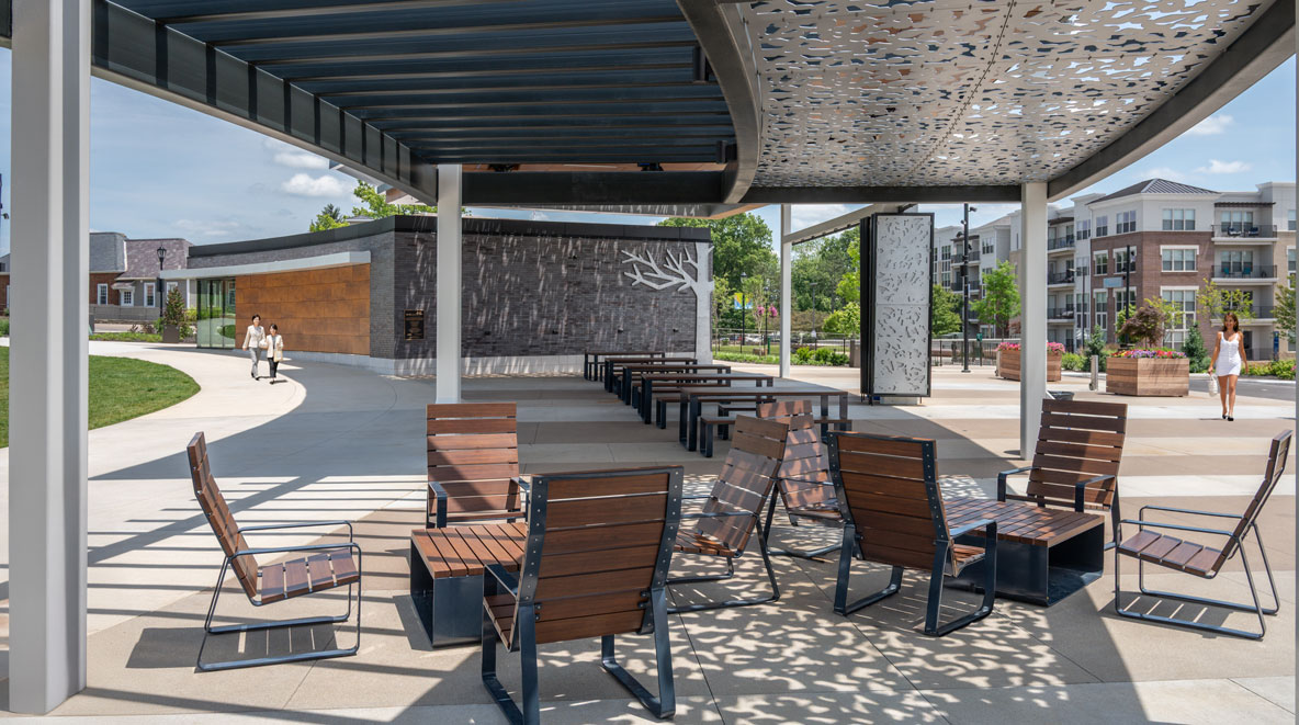 shaded pavilion of the blue ash towne square with a leaf pattern in the metal
