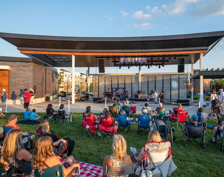 people enjoying a concert on the new pavilion and stage