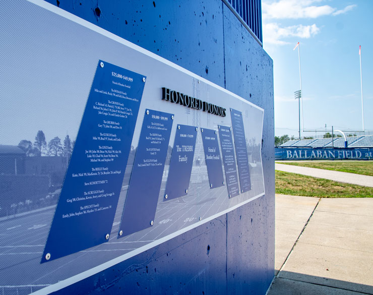 wall entering the space from outside that highlights honored donors of the program