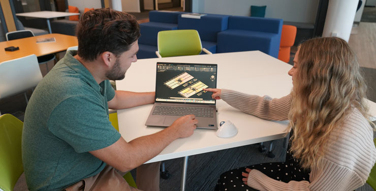 Man and women looking at a computer