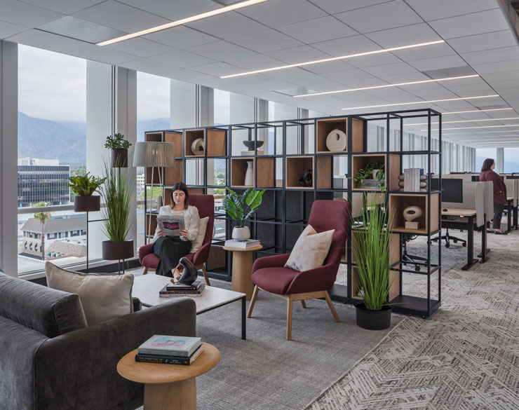 Women reading in an open office space.