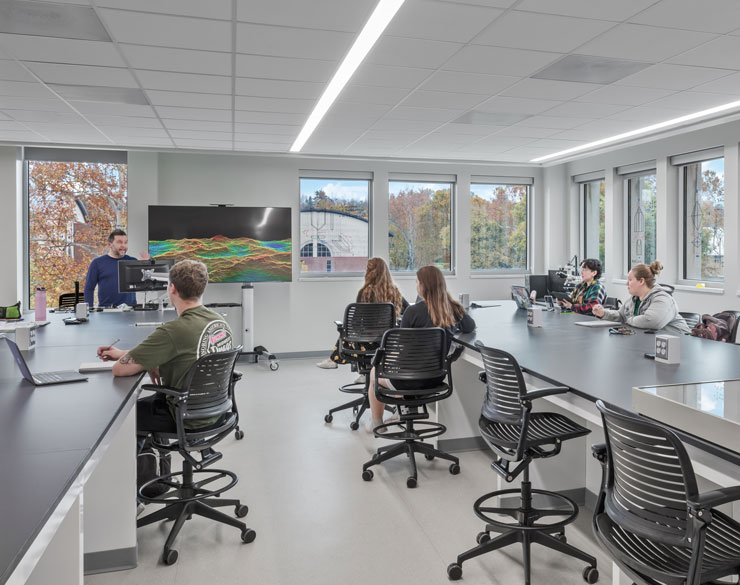 students learning in white classroom