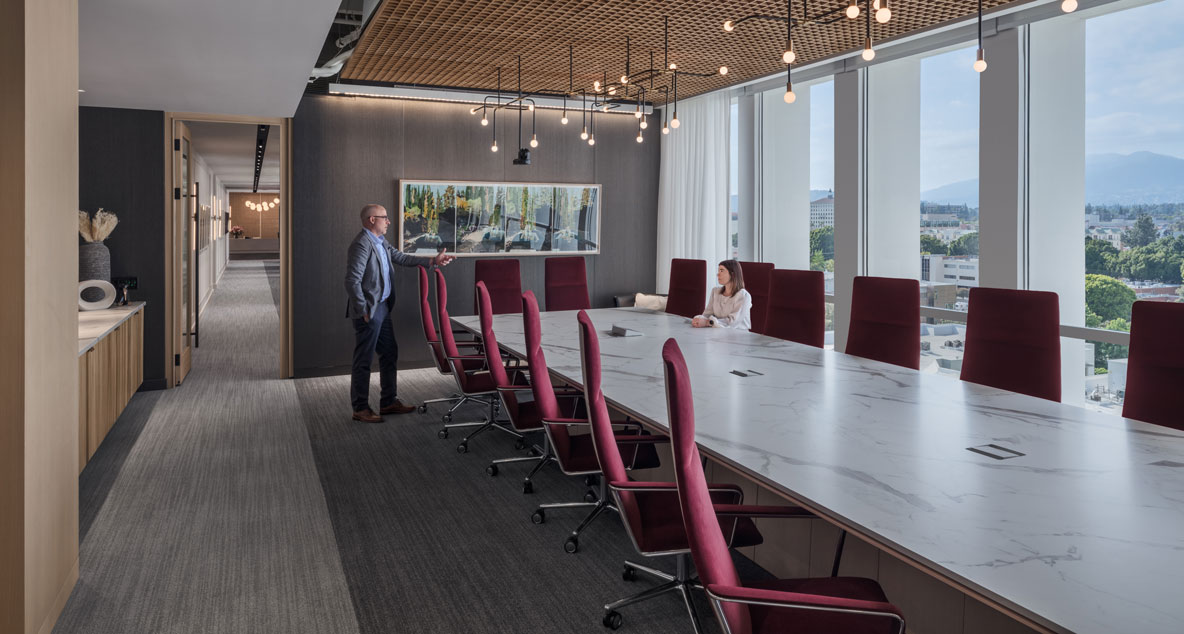 Meeting room with people talking.