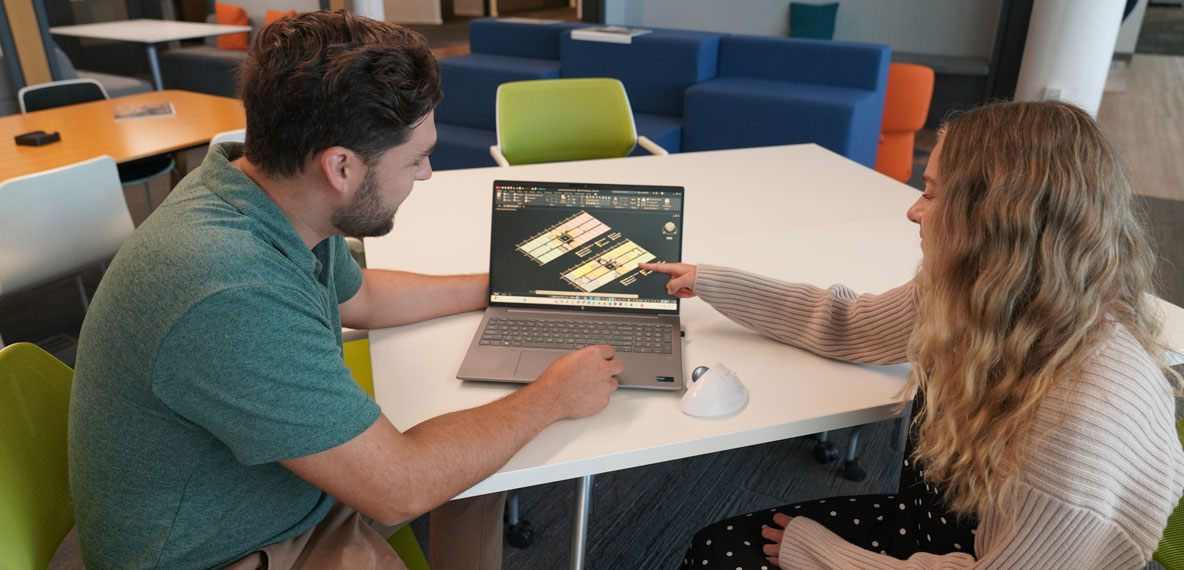 Man and women looking at a computer