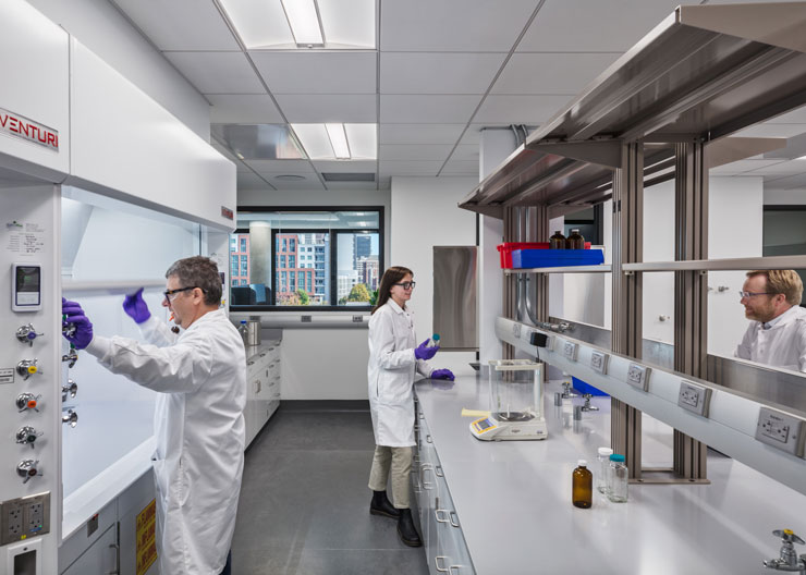 Men and one women working in a lab