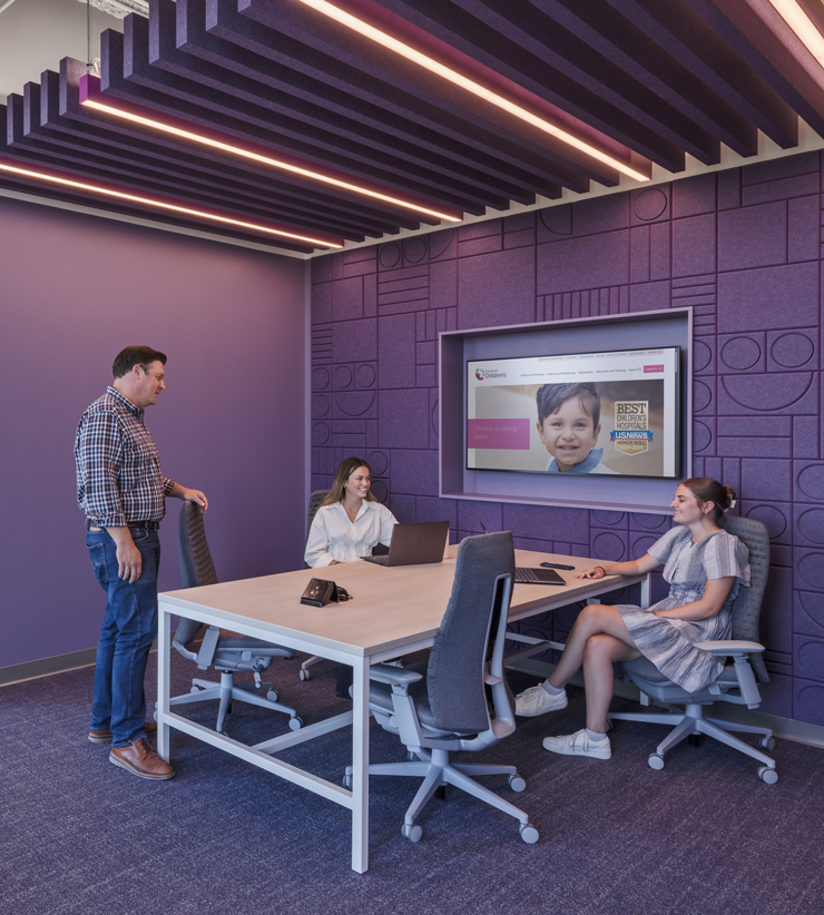 people talking at work station