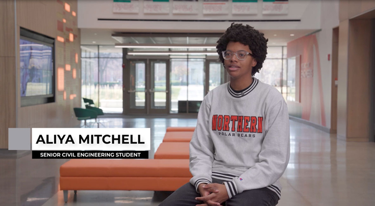 A student appears on screen with text stating her name: Aliya Mitchell