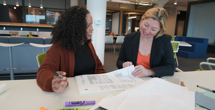 two women working on a project