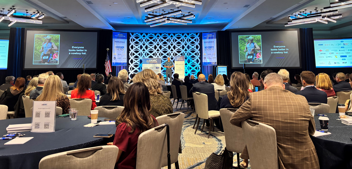 someone on the stage and people in seats