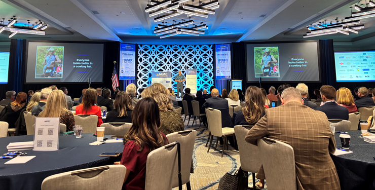 someone on the stage and people in seats