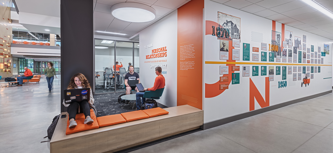 [Bold treatments like this floor-to-ceiling history timeline make the Ohio Northern University James Lehr Kennedy Engineering Building vibrant and help foster high-impact educational experiences.