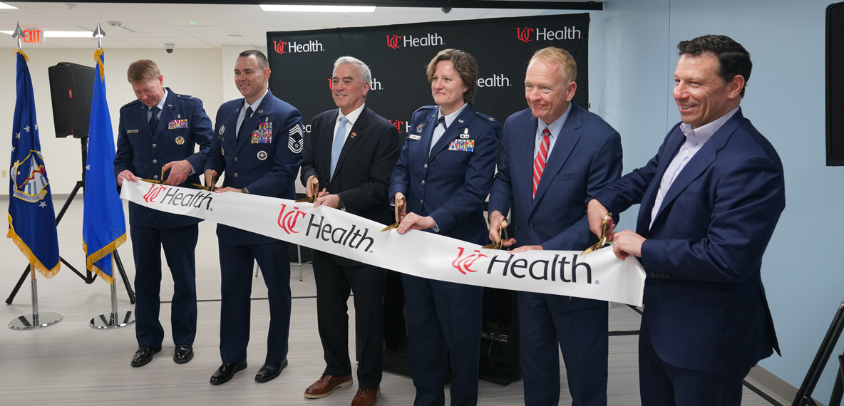 People cutting the ribbon at the UC Health DARRIO Simulation Center Grand Opening