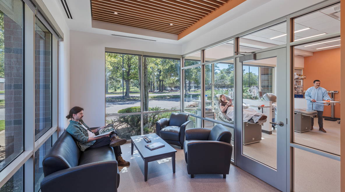 Person in waiting room, and other in blood testing room