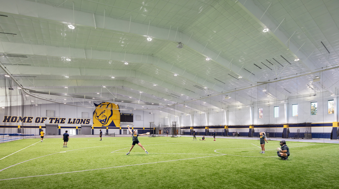 Student athletes practicing softball