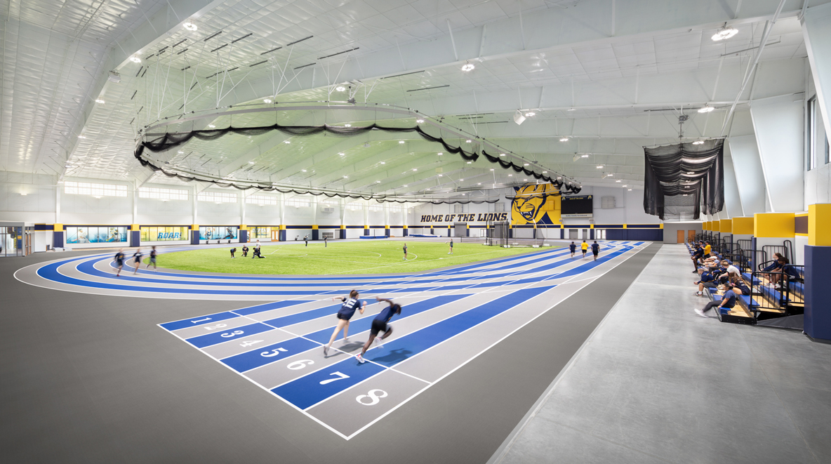 Student athletes using track with spectators