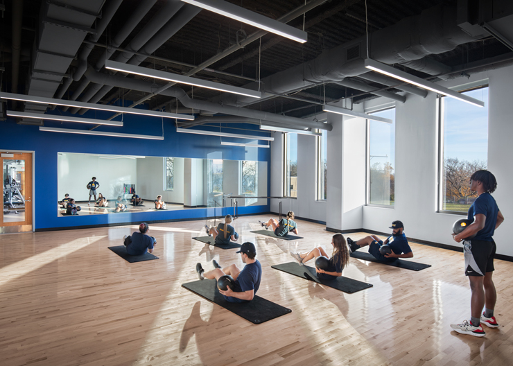Students using multipurpose fitness room