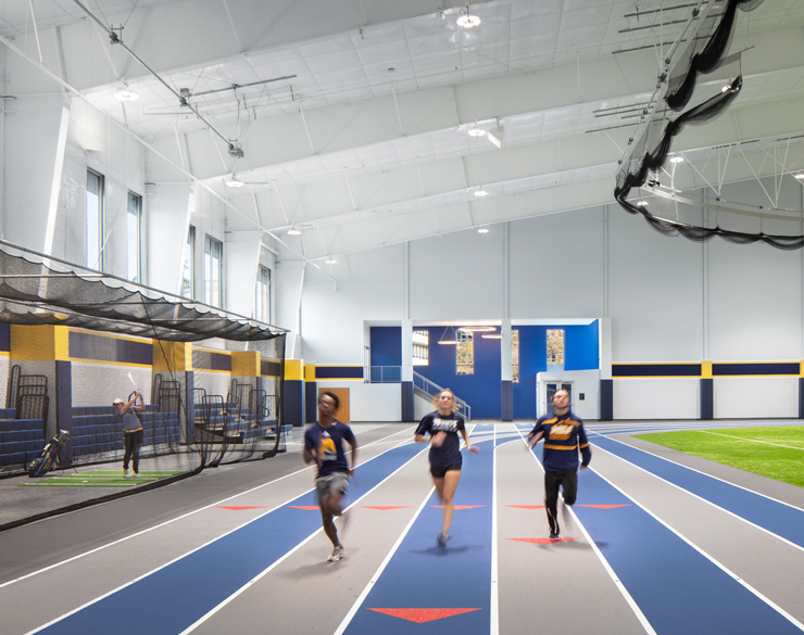 Student athletes running the track 